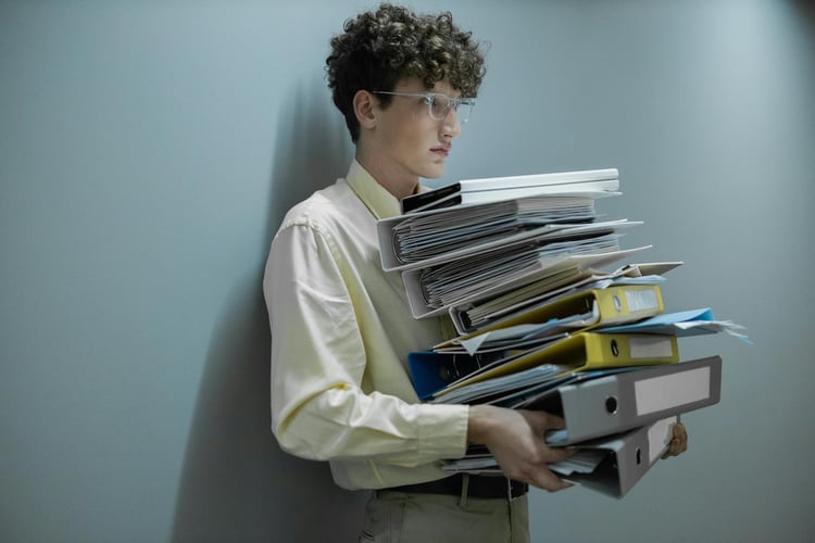 man holding HR files